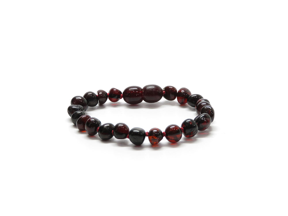 Barnsteen Kers armband (rood draad)